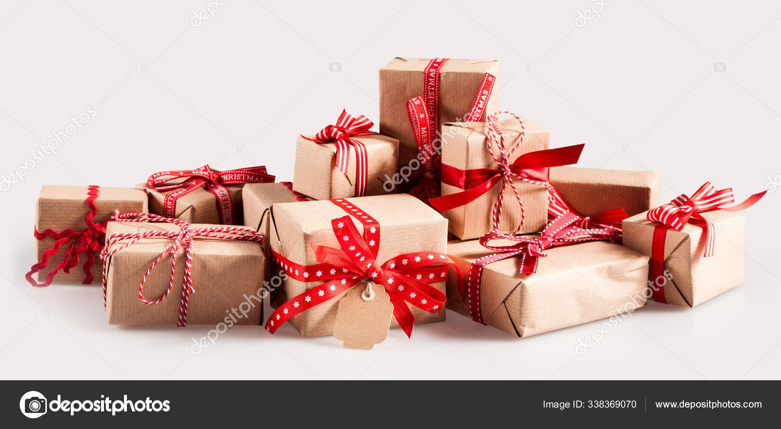 Pile Christmas Gifts Colorful Red Bows Wrapped Brown Paper Gift Stock Photo  by ©PantherMediaSeller 338369070
